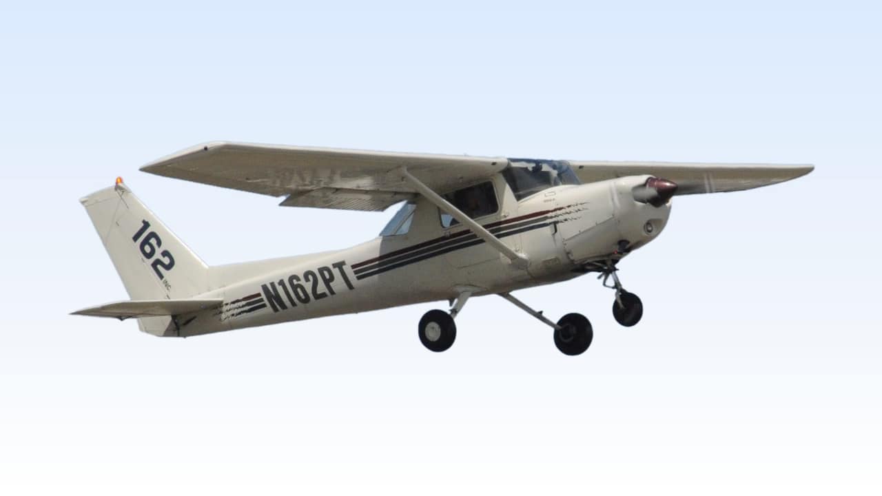 AeroTech Test’s Cessna 152, tail number N162PT, in flight